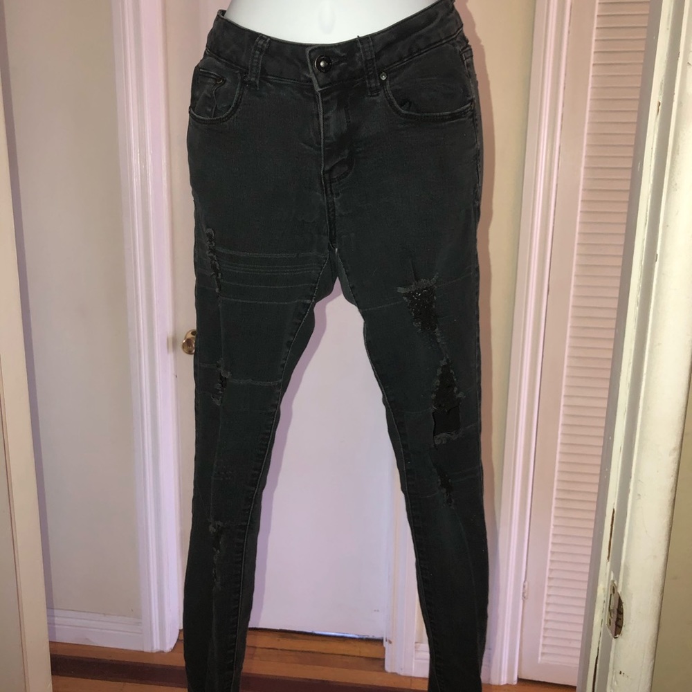 Black jeans with distressed legs
